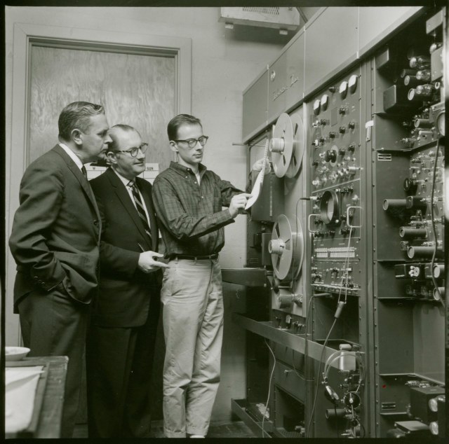 Dr. George Batka (left), consults with Dr. Theodore Aylesworth (center) and a student in the UMD television studio, 1962.