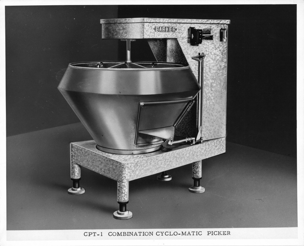 A large, square machine that resembles an industrial stand mixer. 