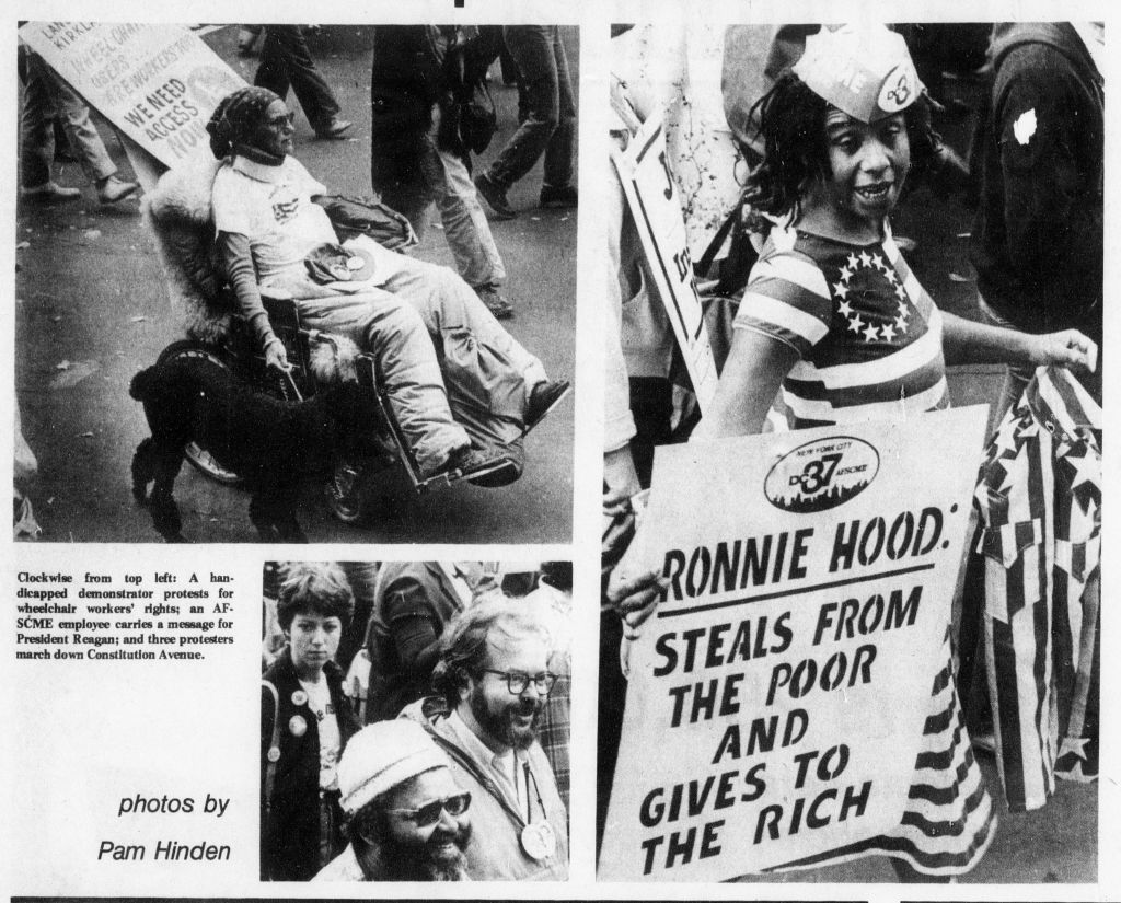 Black and white photos from a newspaper article. There are three photos. The right column is a photo of a young Black woman walking in the street, holding a sign that says "Ronnie Hood: Steals from the poor and gives to the rich". She is wearing a sailors hat and an American flag dress. To the left, in  the upper section is a square photograph of a woman in a wheelchair in the street. In her right hand she is holding the leash of a dog and in her left, she is holding a protest sign. Below that is a small photo of three people walking in the street, smiling and looking straight ahead. 