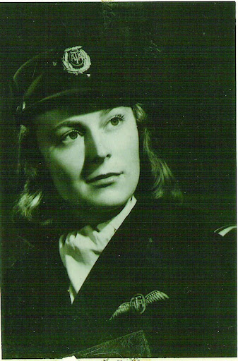 A black and white portrait of a young Betty Lussier in her Canadian Air Transport Auxiliary uniform.